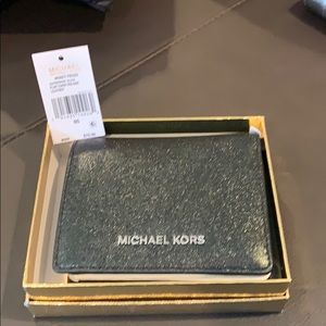 Brand new Michael Kors black metallic wallet.